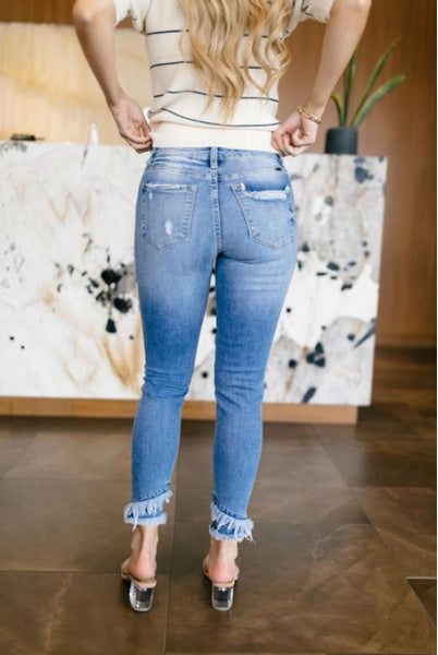 Distressed Mid Rise Skinny Jeans